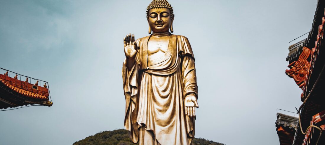 Buddhist Religious Tour India banner featuring Buddha statue and sacred Buddhist pilgrimage destinations in India