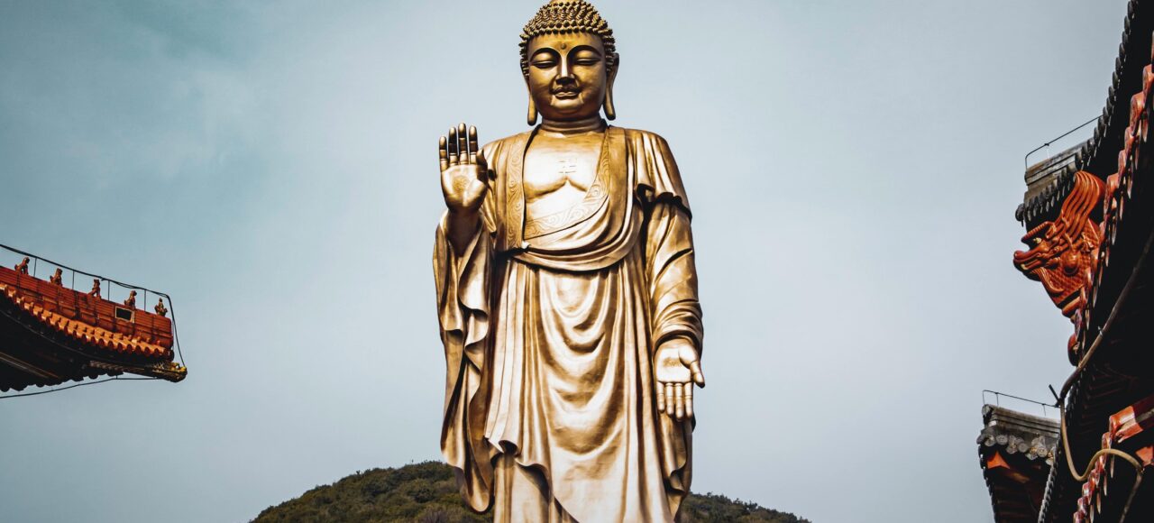 Buddhist Religious Tour India banner featuring Buddha statue and sacred Buddhist pilgrimage destinations in India